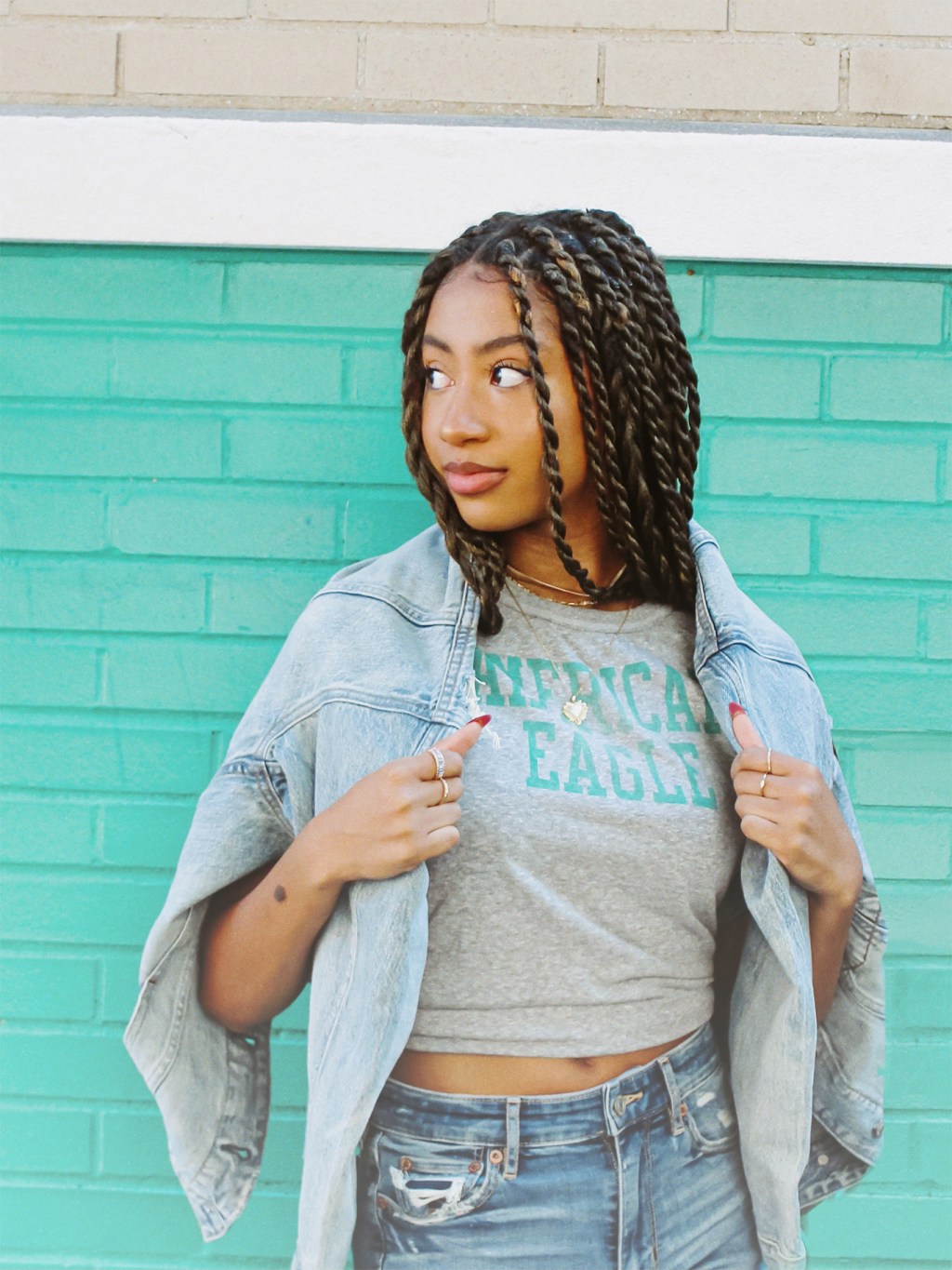 woman wearing a graphic tee and jeans
