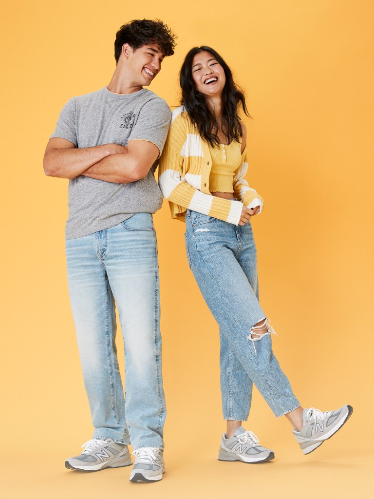 man and woman wearing light wash jeans