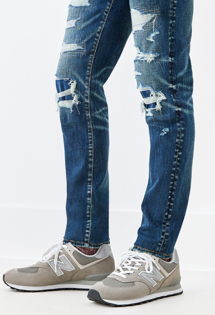 American Eagle ripped jeans with gray sneakers