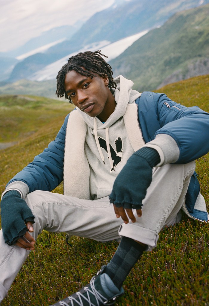 man wearing a gray American Eagle hoodie and blue jacket