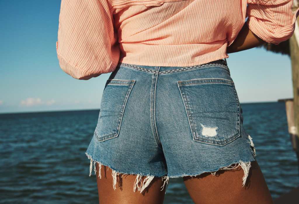 close up view of denim 90s boyfriend shorts from american eagle