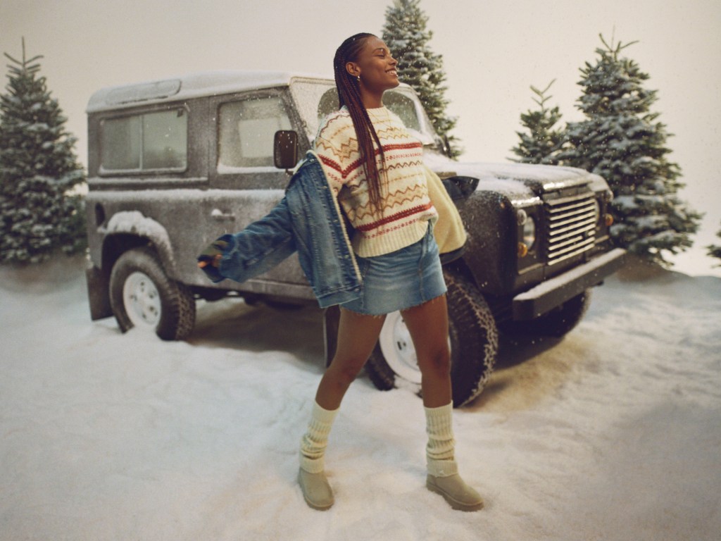 girl wearing a denim mini skirt, striped sweater, and denim jacket from American Eagle