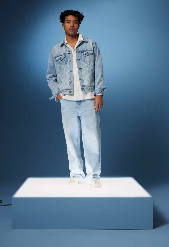 guy wearing a white shirt, denim jacket, and baggy jeans from american eagle