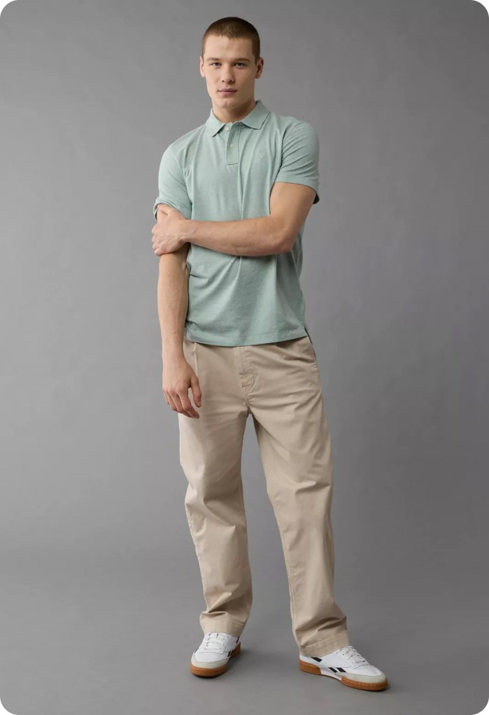 guy wearing a green polo shirt and tan khaki pants from american eagle