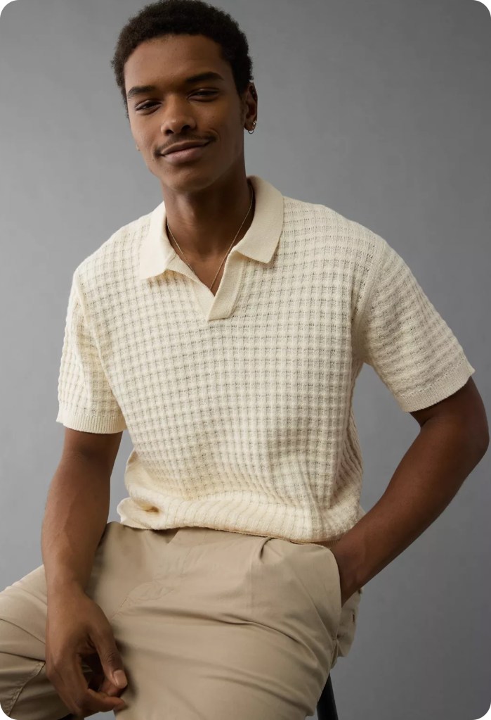 guy wearing a tan sweater polo and khakis from american eagle