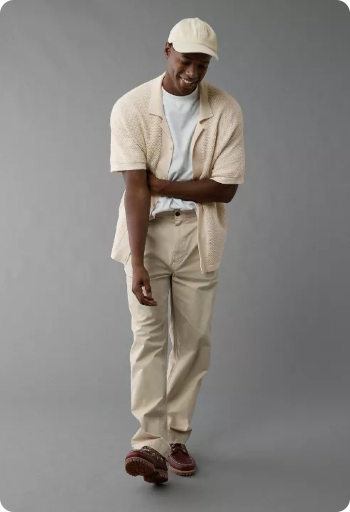 guy wearing a tan sweater polo and khakis from american eagle