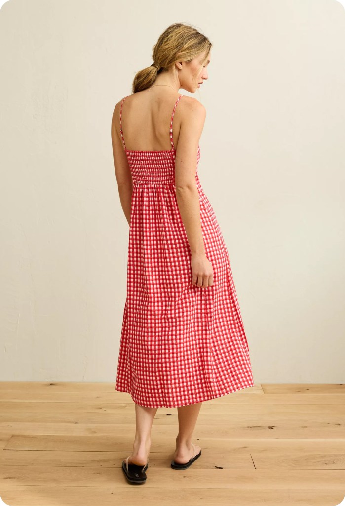 woman wearing a red and white plaid babydoll dress from american eagle