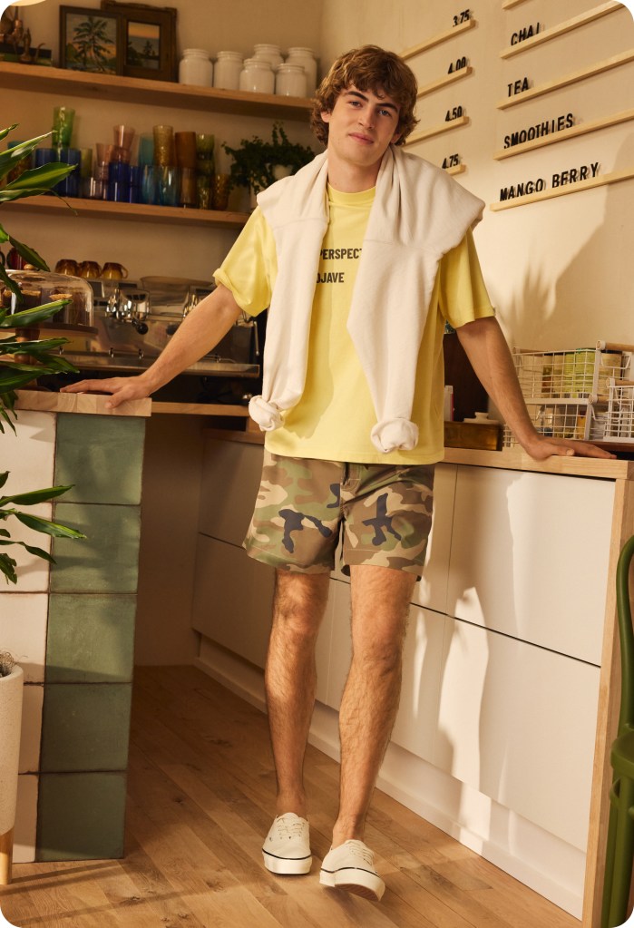 guy wearing a t-shirt and 5 inch camo shorts from american eagle