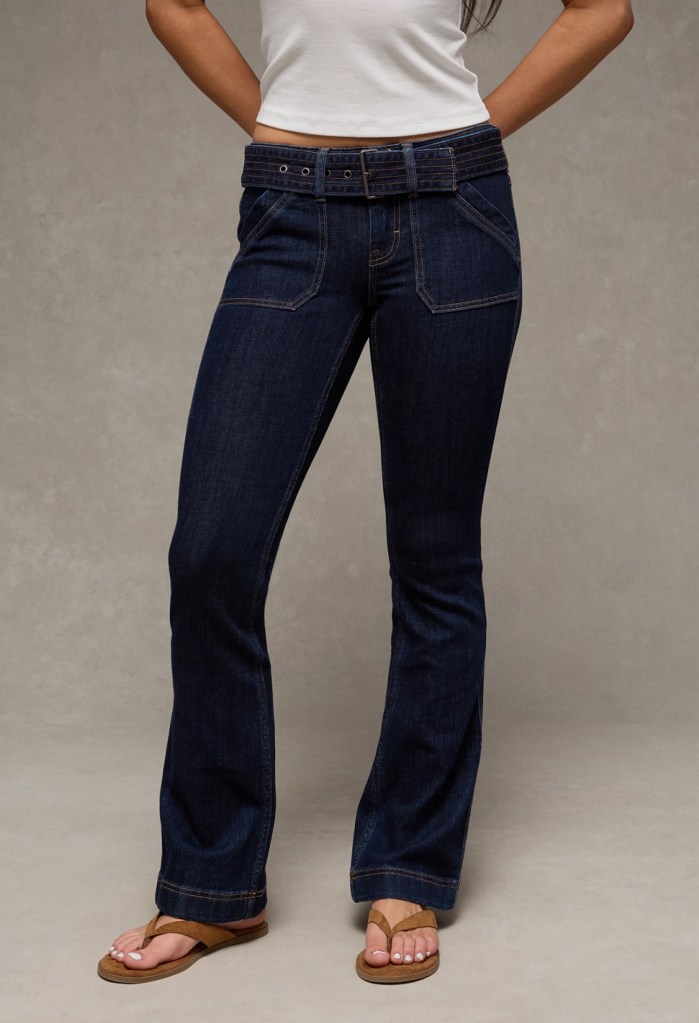 Model wearing American Eagle women's bootcut jeans, front view.
